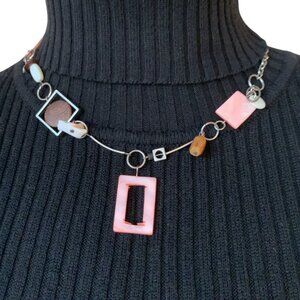 Short pink necklace with different type of pendant, beads with bird pendant